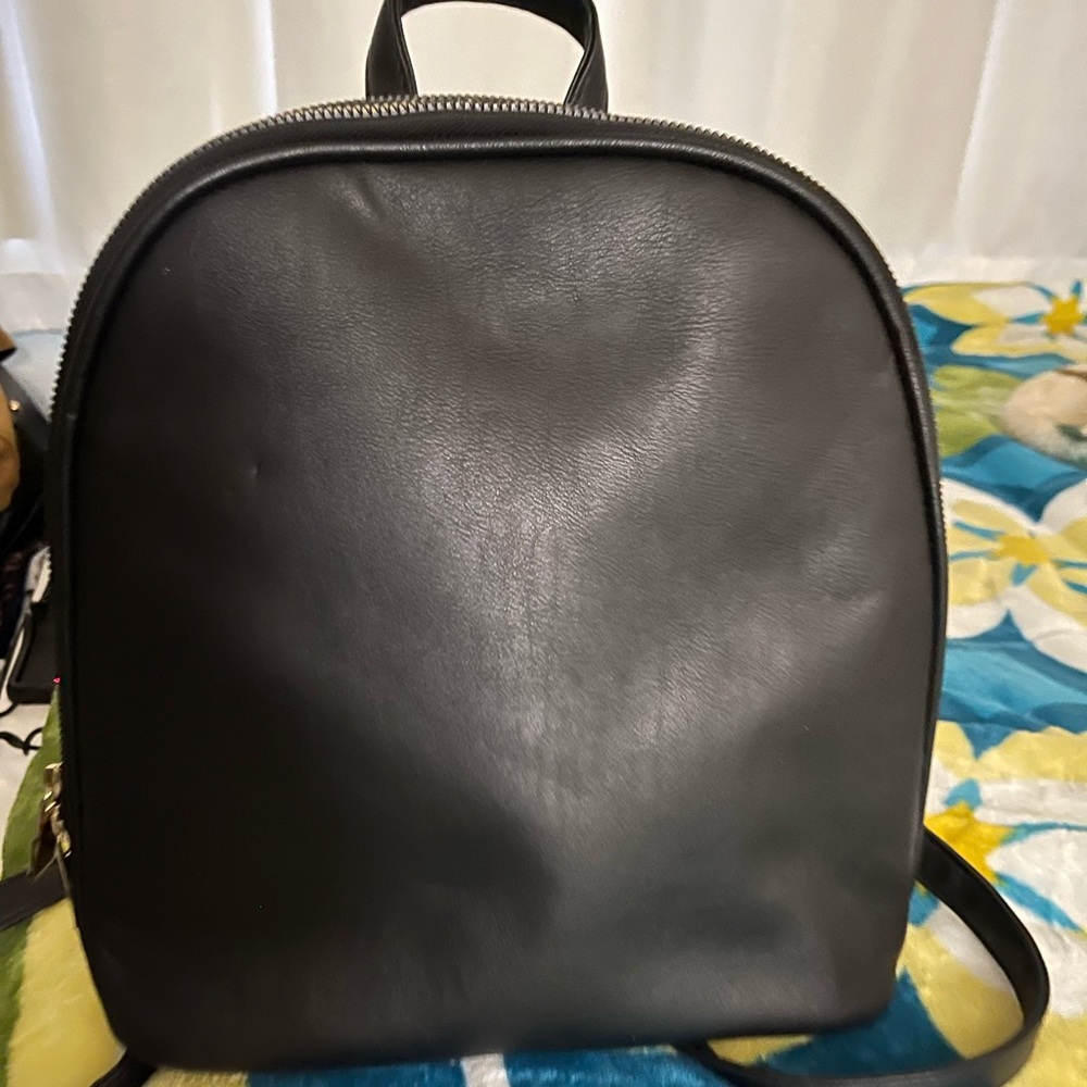 Black trendy, backpack in good condition.